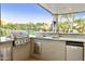 Modern outdoor kitchen with a built-in grill, sink, and mini-fridge at 5301 E Calle Del Norte --, Phoenix, AZ 85018