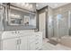 Bathroom with a large vanity, walk-in shower and linen closet at 5622 S Tobin Ave, Mesa, AZ 85212