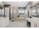 Spa-like bathroom with soaking tub, walk-in shower, and double vanity at 5622 S Tobin Ave, Mesa, AZ 85212