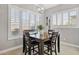 Charming breakfast nook with a dark wood table and four chairs at 5622 S Tobin Ave, Mesa, AZ 85212