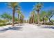 Landscaped walkway with palm trees and shade structures at 5622 S Tobin Ave, Mesa, AZ 85212