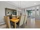 Spacious dining area with a wood table and gray upholstered chairs at 5622 S Tobin Ave, Mesa, AZ 85212