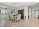 Bright dining room with a wooden table and access to the kitchen at 5622 S Tobin Ave, Mesa, AZ 85212