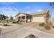 Tan house with covered entryway and driveway at 5622 S Tobin Ave, Mesa, AZ 85212