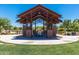 Relaxing gazebo with seating near a pond at 5622 S Tobin Ave, Mesa, AZ 85212