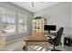 Bright home office features a large desk and built-in shelving at 5622 S Tobin Ave, Mesa, AZ 85212