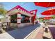 Neighborhood snack bar with outdoor seating and red umbrellas at 5622 S Tobin Ave, Mesa, AZ 85212