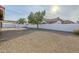 Landscaped backyard with gravel and partial view of neighbor's house at 5821 W Kesler St, Chandler, AZ 85226