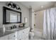 Updated bathroom with white subway tile, granite vanity, and bathtub at 5821 W Kesler St, Chandler, AZ 85226