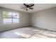 Bright bedroom with ceiling fan and wood-look tile floor at 5821 W Kesler St, Chandler, AZ 85226