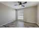 Well-lit bedroom featuring wood-look floors and a ceiling fan at 5821 W Kesler St, Chandler, AZ 85226