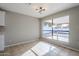 Bright dining area with tile floors and large windows at 5821 W Kesler St, Chandler, AZ 85226