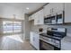 Kitchen with stainless steel appliances and white cabinetry at 5821 W Kesler St, Chandler, AZ 85226