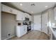 Modern kitchen with white shaker cabinets and stainless steel appliances at 5821 W Kesler St, Chandler, AZ 85226