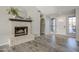 Living room featuring a brick fireplace and wood-look tile floors at 5821 W Kesler St, Chandler, AZ 85226