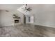 Living room with fireplace and view into kitchen and dining area at 5821 W Kesler St, Chandler, AZ 85226