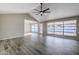 Living room with vaulted ceilings, tile floors and a view to the backyard at 5821 W Kesler St, Chandler, AZ 85226