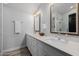 Modern bathroom with double vanity, quartz countertops, and large mirrors at 6131 E Kings Ave, Scottsdale, AZ 85254