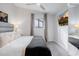 Serene bedroom with king bed, gray walls, and dark accents at 6131 E Kings Ave, Scottsdale, AZ 85254