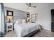 Bright bedroom with king bed, gray headboard, and wood floors at 6131 E Kings Ave, Scottsdale, AZ 85254