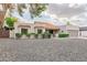 Single-story home with a two-car garage and mature landscaping at 6131 E Kings Ave, Scottsdale, AZ 85254