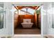 Luxurious outdoor bathroom with soaking tub, wood details, and glass enclosure at 6131 E Kings Ave, Scottsdale, AZ 85254