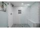 Clean and spacious shower with a built-in seat and glass enclosure at 6131 E Kings Ave, Scottsdale, AZ 85254