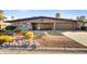 Attractive ranch-style home with landscaped front yard and two-car garage at 723 S Edgewater Dr, Mesa, AZ 85208