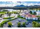 Aerial view of community clubhouse near lake and mountains at 7500 E Mccormick Pkwy # 78, Scottsdale, AZ 85258