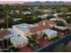 Aerial view of a luxurious home with a red driveway and mountain views at 7500 E Mccormick Pkwy # 78, Scottsdale, AZ 85258