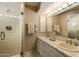 Bright bathroom with double vanity and glass shower at 7500 E Mccormick Pkwy # 78, Scottsdale, AZ 85258