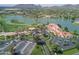 Aerial view of a community clubhouse near a lake and golf course at 7500 E Mccormick Pkwy # 78, Scottsdale, AZ 85258