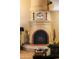 Large fireplace with ornate tile work in the living room at 7500 E Mccormick Pkwy # 78, Scottsdale, AZ 85258