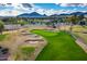 Aerial view of a lush golf course with sand traps and palm trees at 7500 E Mccormick Pkwy # 78, Scottsdale, AZ 85258