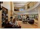 Spacious living room with a two-story high ceiling and a fireplace at 7500 E Mccormick Pkwy # 78, Scottsdale, AZ 85258