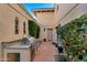 Private patio with outdoor kitchen and lush landscaping at 7500 E Mccormick Pkwy # 78, Scottsdale, AZ 85258