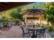 Outdoor patio with seating, fire pit, and umbrella at 7500 E Mccormick Pkwy # 78, Scottsdale, AZ 85258