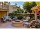 Relaxing patio area with fire pit and lounge chairs at 7500 E Mccormick Pkwy # 78, Scottsdale, AZ 85258