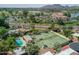 Aerial view of tennis courts and pool with surrounding community at 7500 E Mccormick Pkwy # 78, Scottsdale, AZ 85258