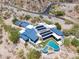 Luxury home with pool, and solar panels, aerial view at 7537 N Lakeside Ln, Paradise Valley, AZ 85253