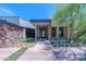 Modern home exterior with stone accents and landscaping at 7537 N Lakeside Ln, Paradise Valley, AZ 85253