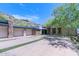 Three-car garage with stone and stucco exterior at 7537 N Lakeside Ln, Paradise Valley, AZ 85253