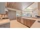 Modern kitchen with stainless steel appliances and light wood cabinets at 7537 N Lakeside Ln, Paradise Valley, AZ 85253