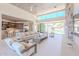 Bright living area with kitchen and outdoor access, featuring a stone fireplace at 7537 N Lakeside Ln, Paradise Valley, AZ 85253