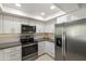 Modern kitchen with stainless steel appliances and white cabinets at 7756 E Coralbell Ave, Mesa, AZ 85208