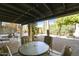 Covered patio with seating area,string lights, and desert landscaping at 7756 E Coralbell Ave, Mesa, AZ 85208