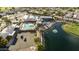 Aerial view of community pool, tennis courts, and lake at 7756 E Coralbell Ave, Mesa, AZ 85208