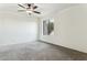 Spacious bedroom with ceiling fan and neutral carpeting at 7777 E Main St # 228, Scottsdale, AZ 85251