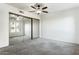 Bright bedroom with mirrored closet doors and ceiling fan at 7777 E Main St # 228, Scottsdale, AZ 85251