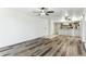 Open living area with wood-look floors and kitchen at 7777 E Main St # 228, Scottsdale, AZ 85251